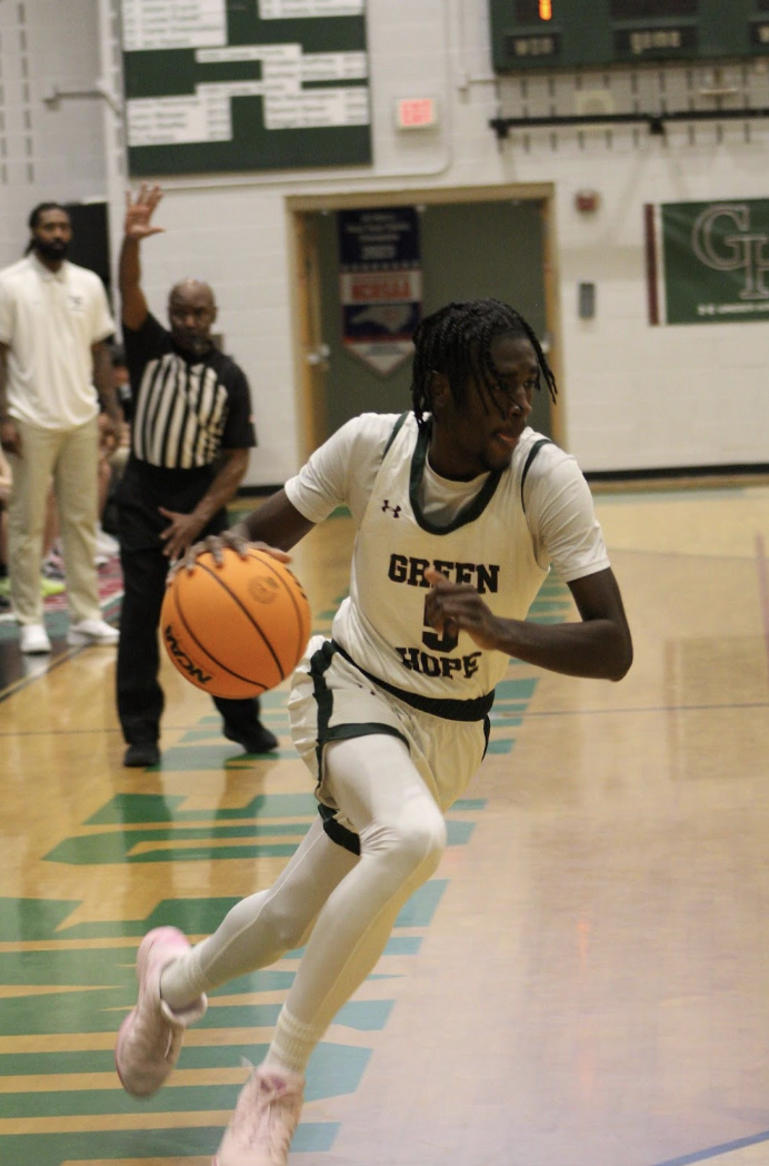 Michael Joof ('25) drives to the basket for a layup. Joof has started every conference game the Falcons have played.